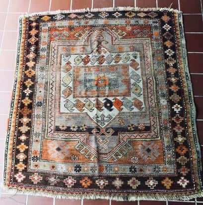 this antique rug is hand knotted & made of wool. Colors are still vibrant! It is referred to as a Hamadan ( or Hamedan) named after what is thought to be one of the the oldest cities in Iran ( Persia) & is a major city west of Tehran.